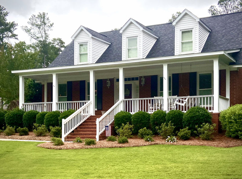 Farmhouse porch beds dressed in long leaf straw